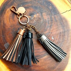Keychain with three leather, tassels, black, silver and bronze